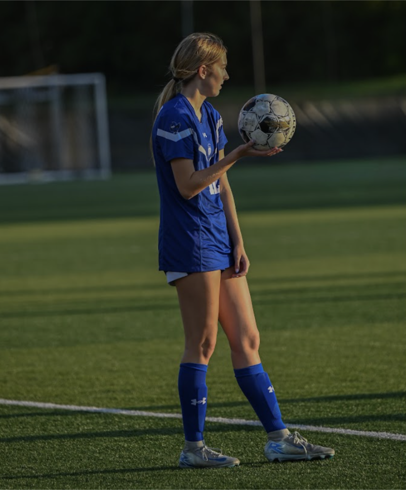 Outside back Maddy Lickert (11) gets ready to throw the ball in. 