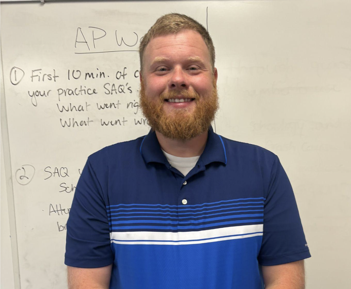 World History teacher, Ryan Hahn poses for a picture.