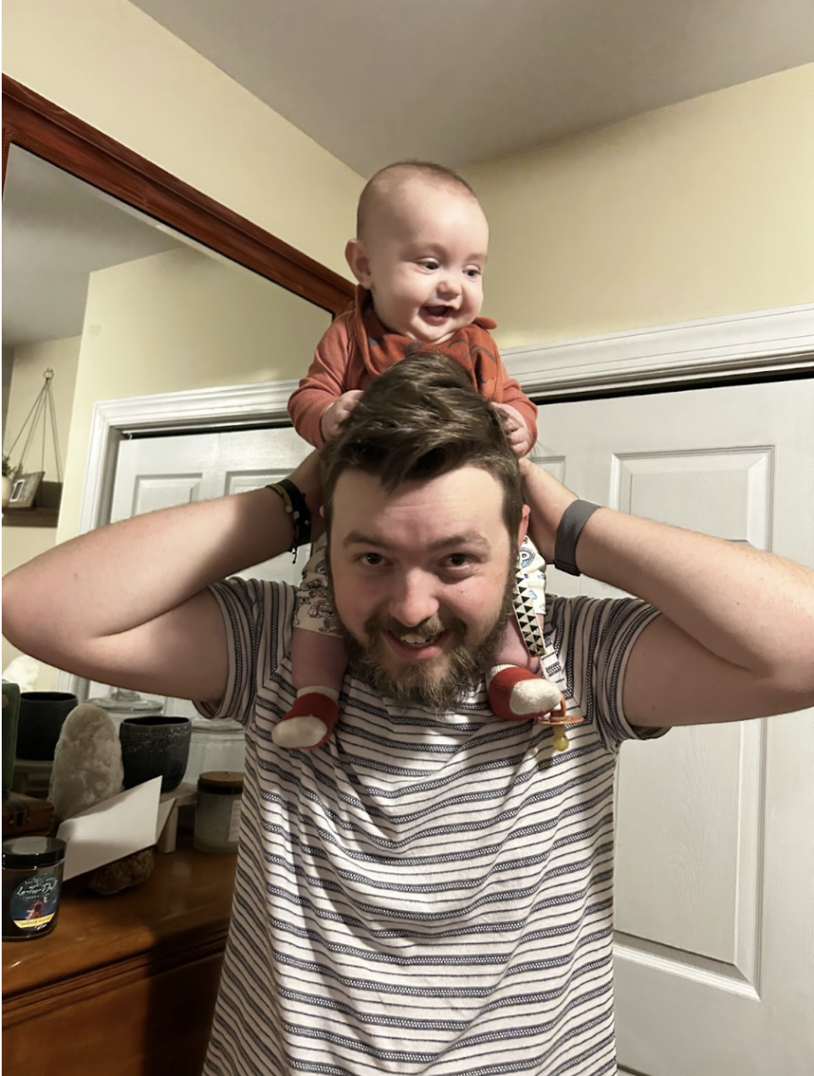Seith holds his son on his shoulders as his wife captures the moment. (Colin Seith)