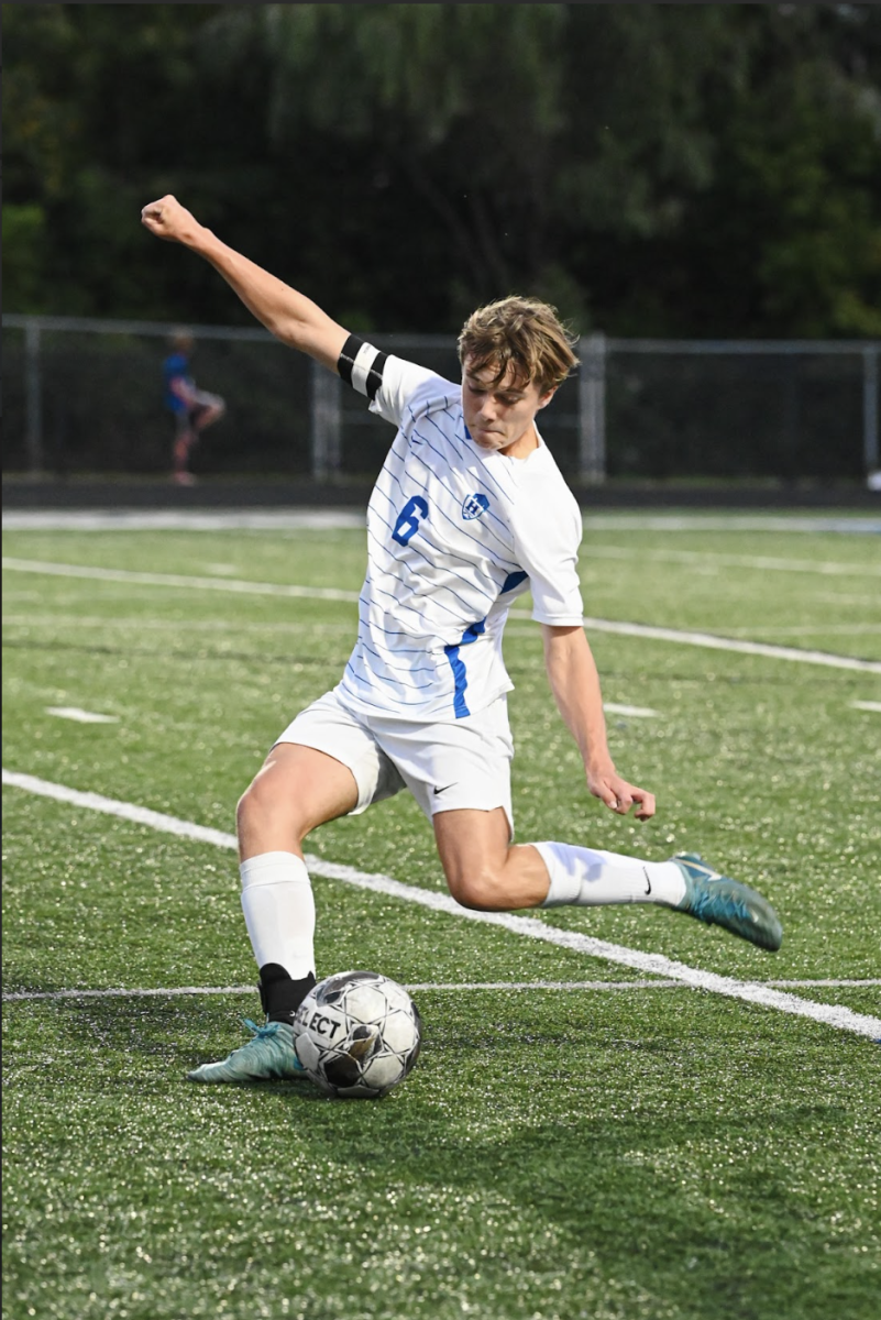 Wade Fedders (11) kicks the ball to his teammate.