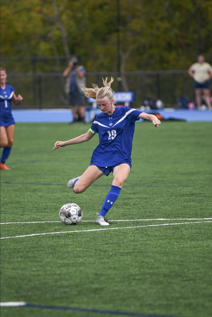 Macy Hargis (12) takes a shot on the goal.