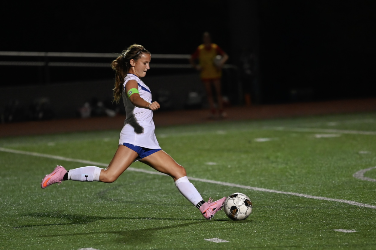 Franny Smith (12) shoots the ball down the field.