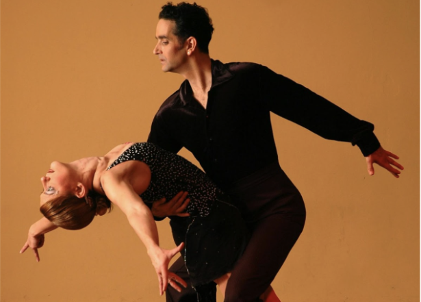 Man & Women hit the ending pose after ballroom dancing (photo by Pixabay via Pexels).