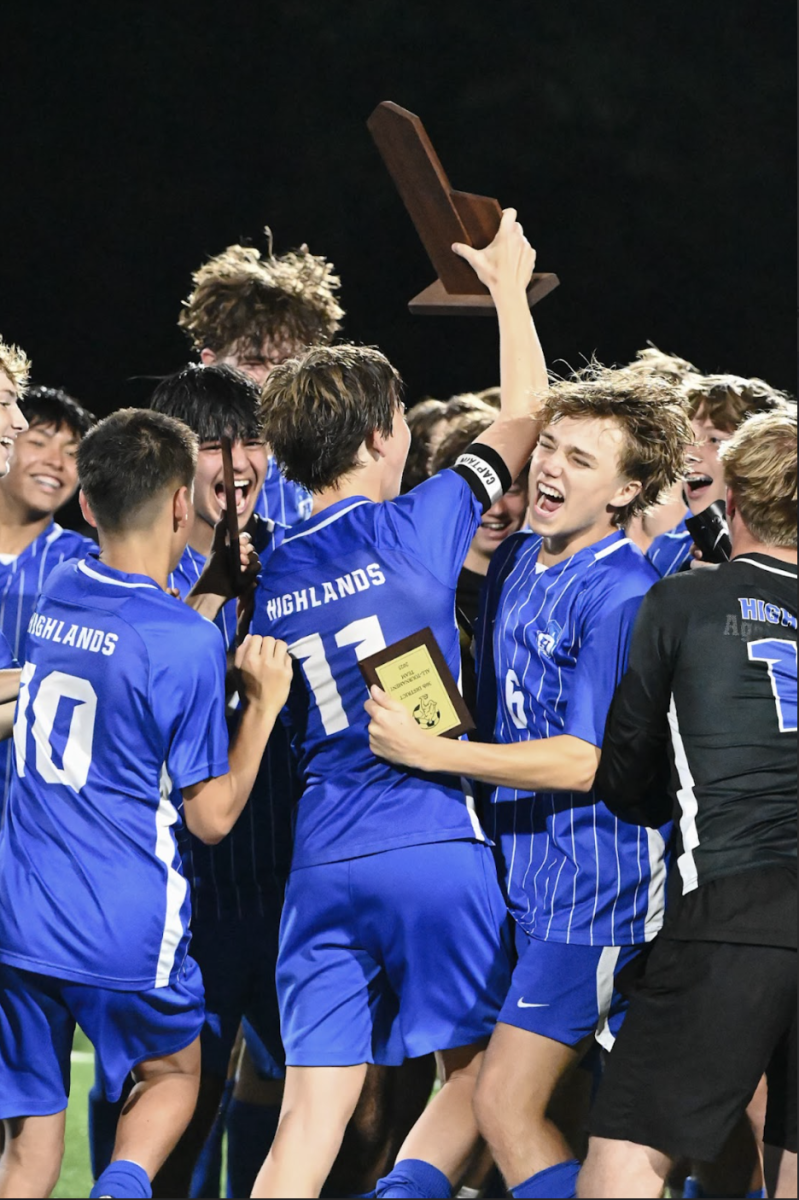 The Highlands Boys soccer team celebrates after winning the 36th District Final versus NCC.