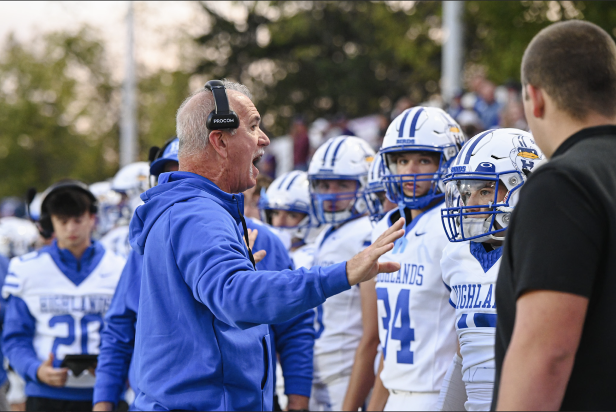  Coach Bob Sphire talks to his players before the game begins.