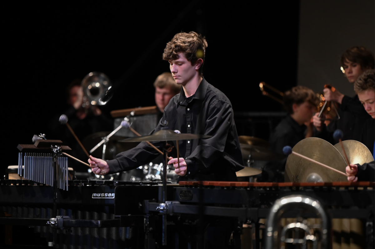 Brady Smith (11) performs the song "1,000 years" in the fall band concert.