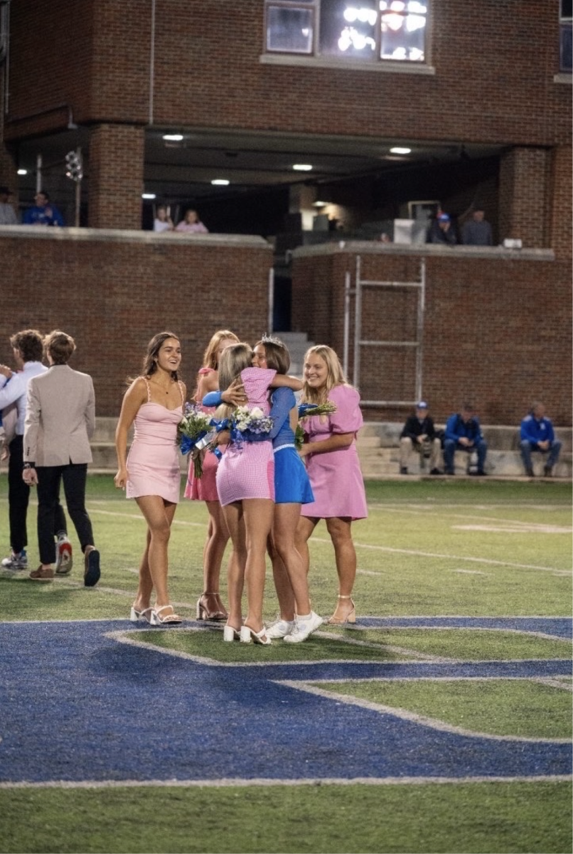 Ella Cunningham (‘25) is congratulated by her friends after winning homecoming queen at the football game (Provided by Ella Cunningham).