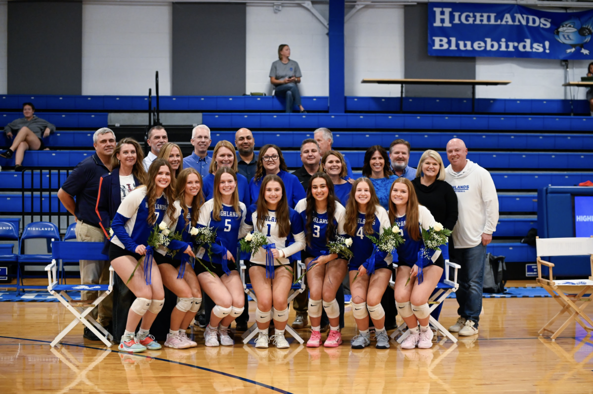 Audrey Sorrentino (12), Mia Perron (12), Liz Perkins (12), Hayden Gessner (12), Ava Muzumdar (12), Amelia Frommeyer (12), and Madison Barlow (12) are all accompanied by their parents as they take a senior group photo.