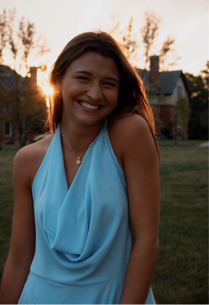 Ellie Niese (11) poses for a picture in front of the sunset (Taken by Jude Borden).