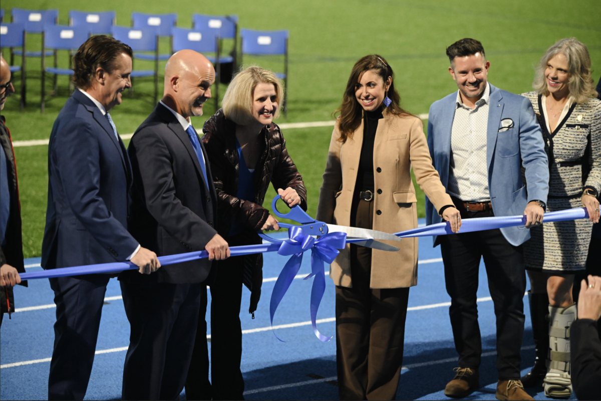 Julie Kuhnhein along with the Board of Education cut the ribbon to celebrate the official opening of the Tower Park Athletic complex.