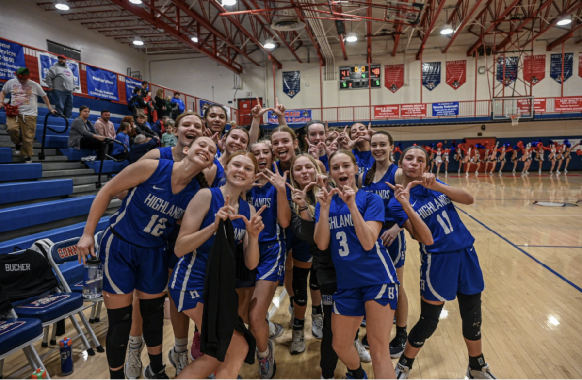 The 2024 girls basketball team poses with their W’s after a win making them top 25 in the state.