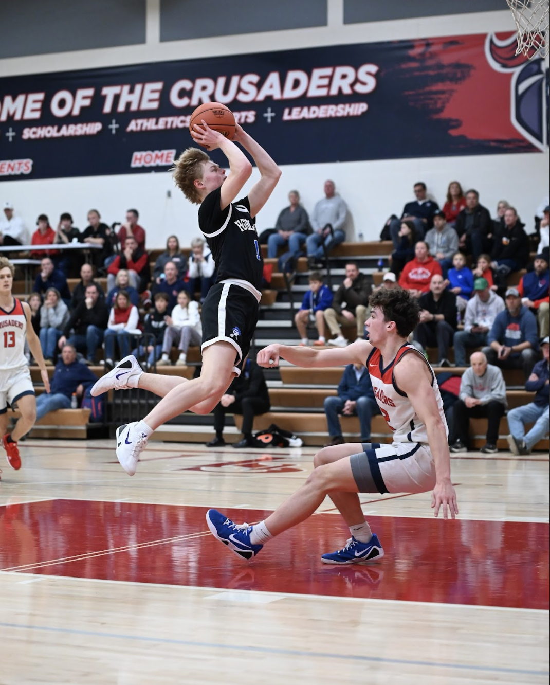 Finn Bouldin (12) goes for a floater.