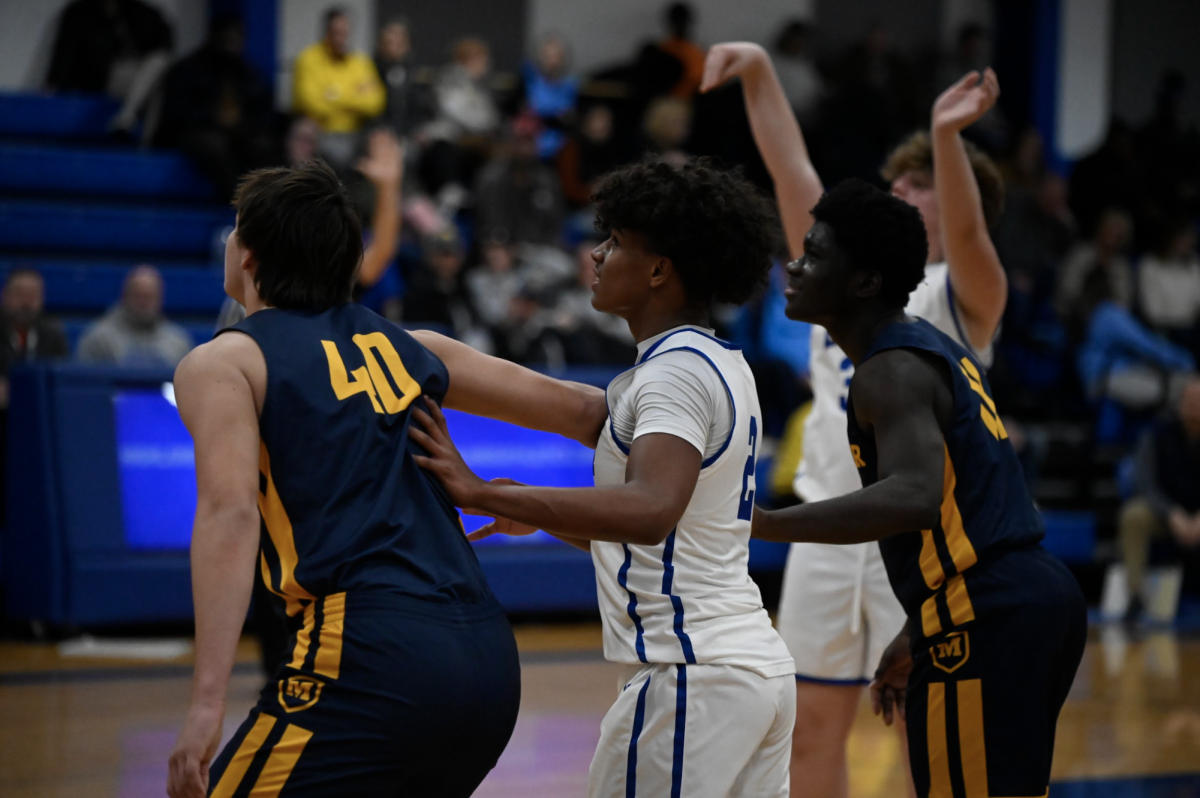 Bryce Armstrong (9) stands ready under the basket. "I feel like I shared the ball with my team and was a leader on the court," Armstrong said.
