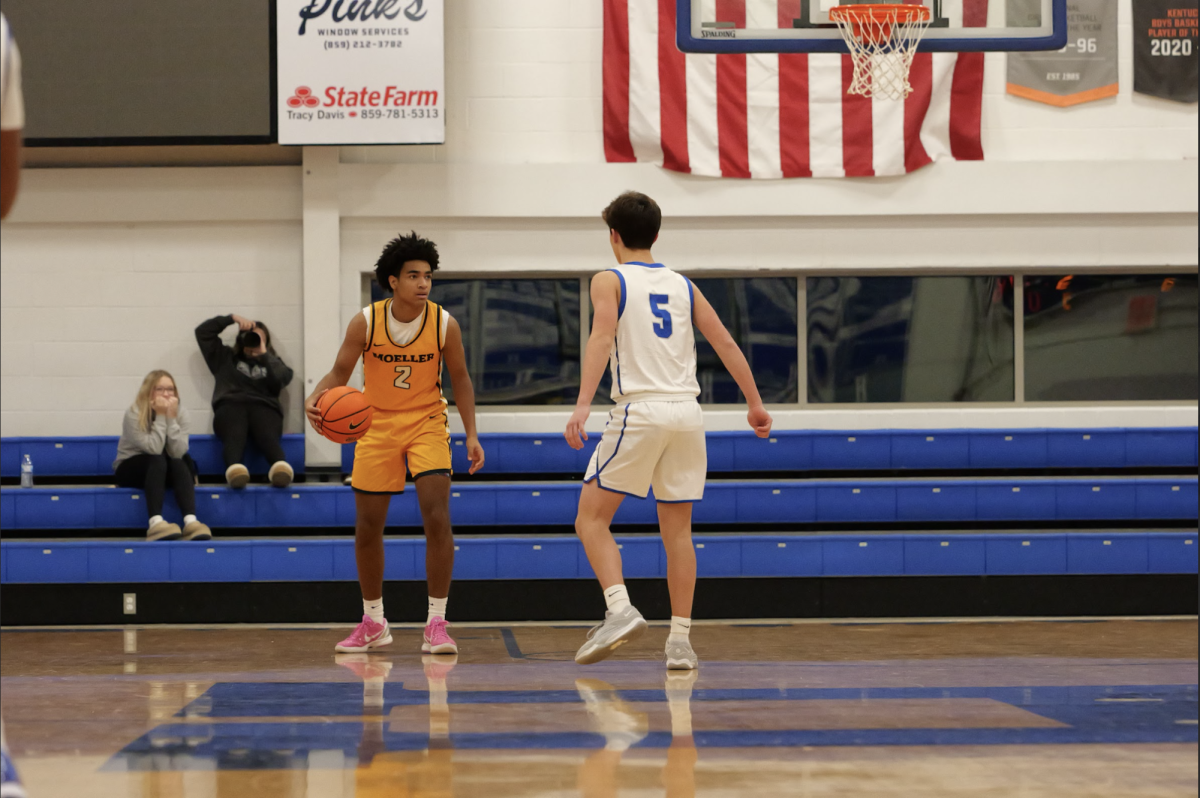 Noah Wells (11) closes in on a Moeller player who has the ball.