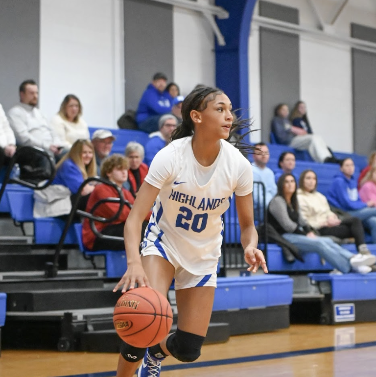 Solu Nzekwu (8) drives along the baseline while she looks for an open teammate. 