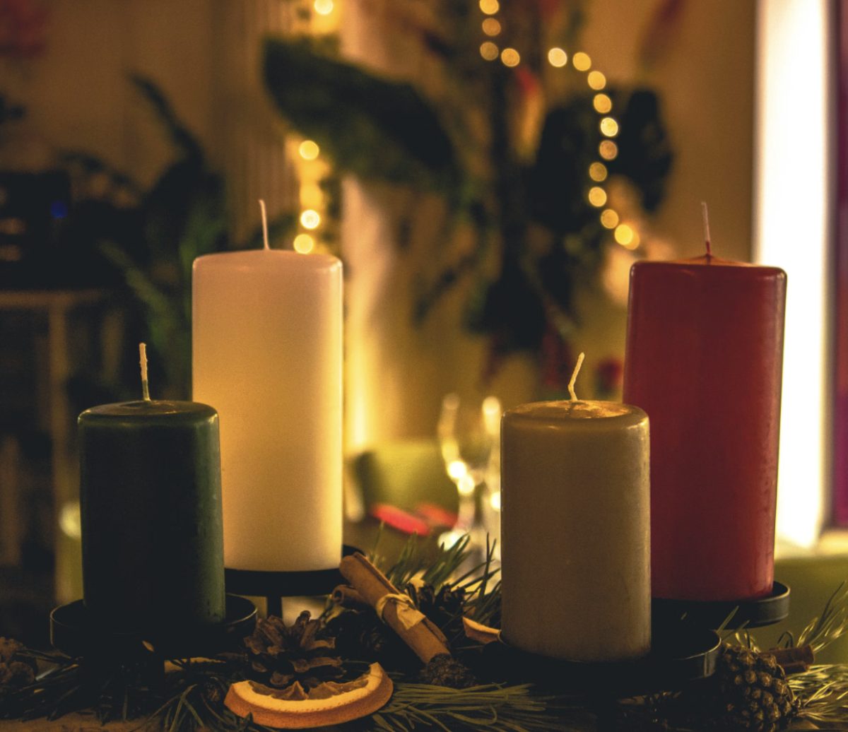 Yule altars are typically decorated with candles, protective items, crystals, pine branches, sage, and other symbols of the holiday. (Courtesy of Ruyan Ayten, Unsplash)