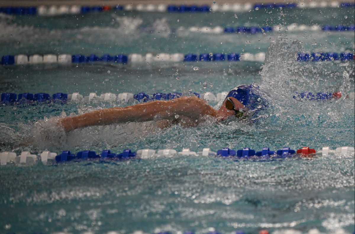 Ryan Schaber (11) glides through the water as he swims freestyle.