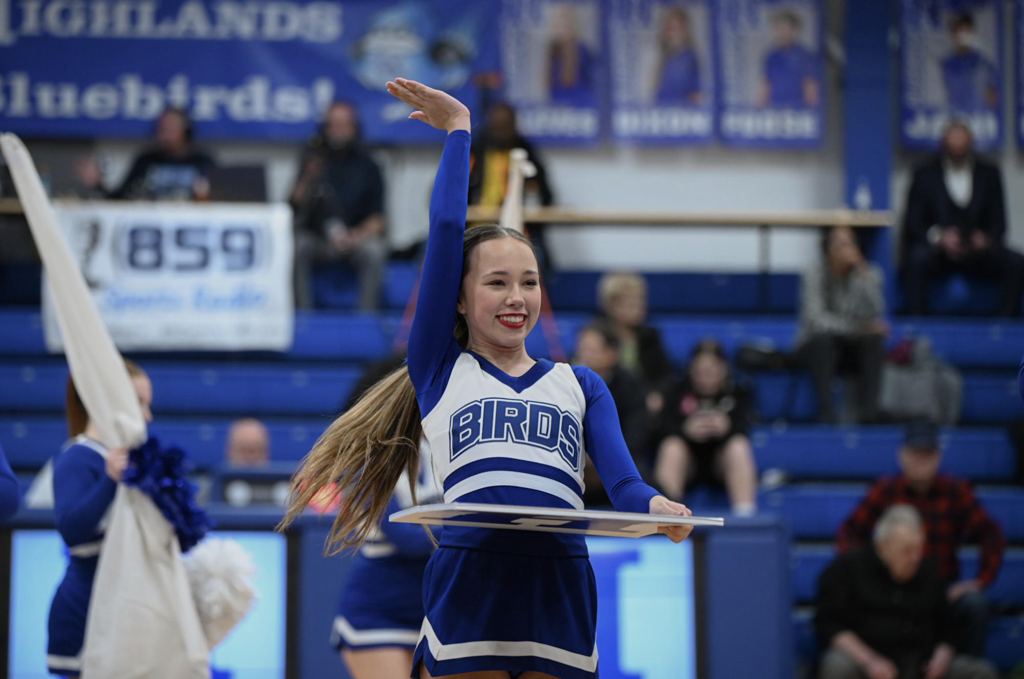 Gabby Houze (9) waves to the crowd.