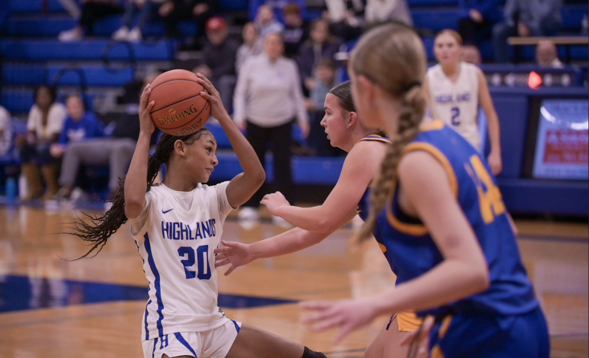 Solu Nzekwu (8) holds the ball up and away from the other team.
