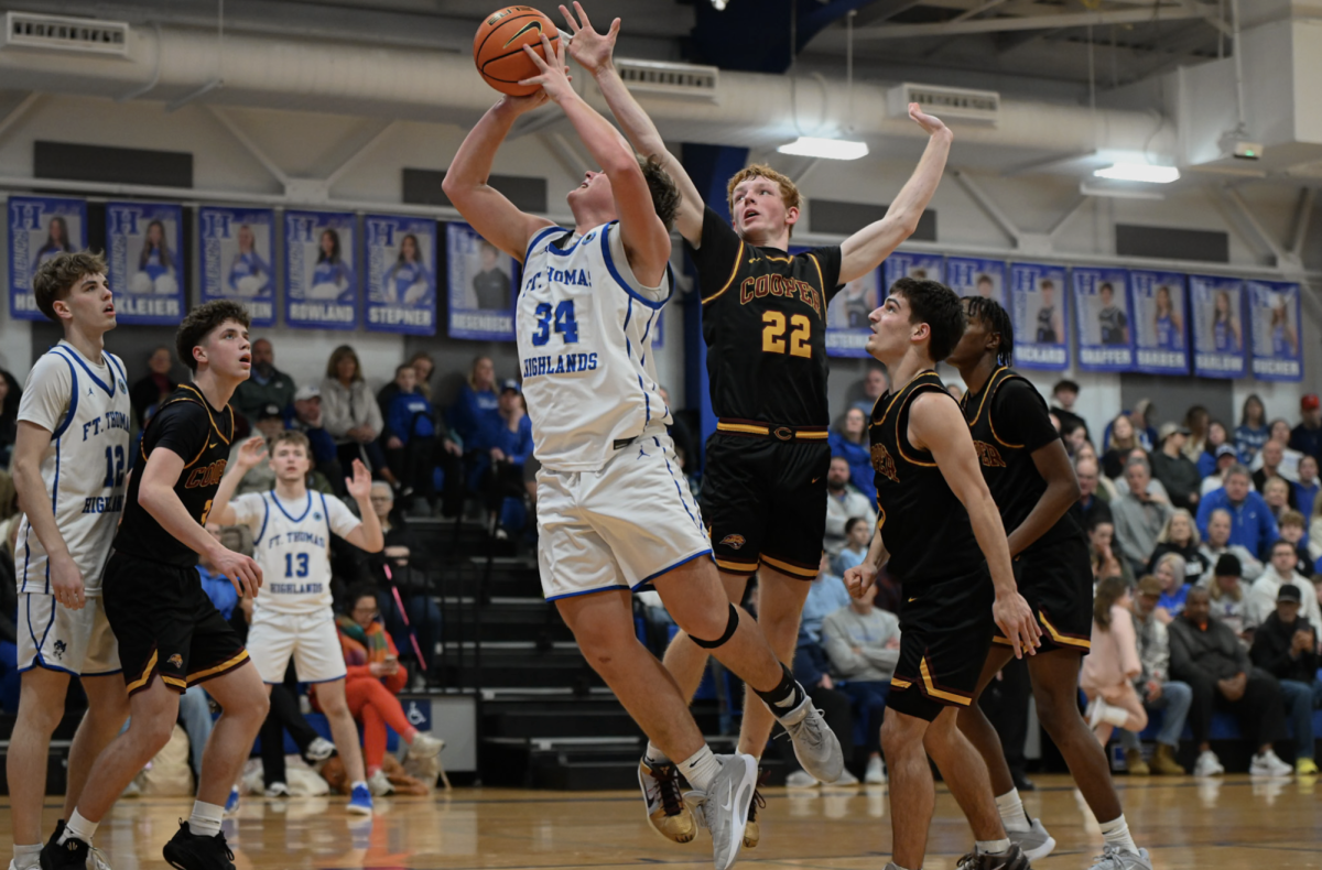 Tayden Lorenzen (11) goes in for a layup.