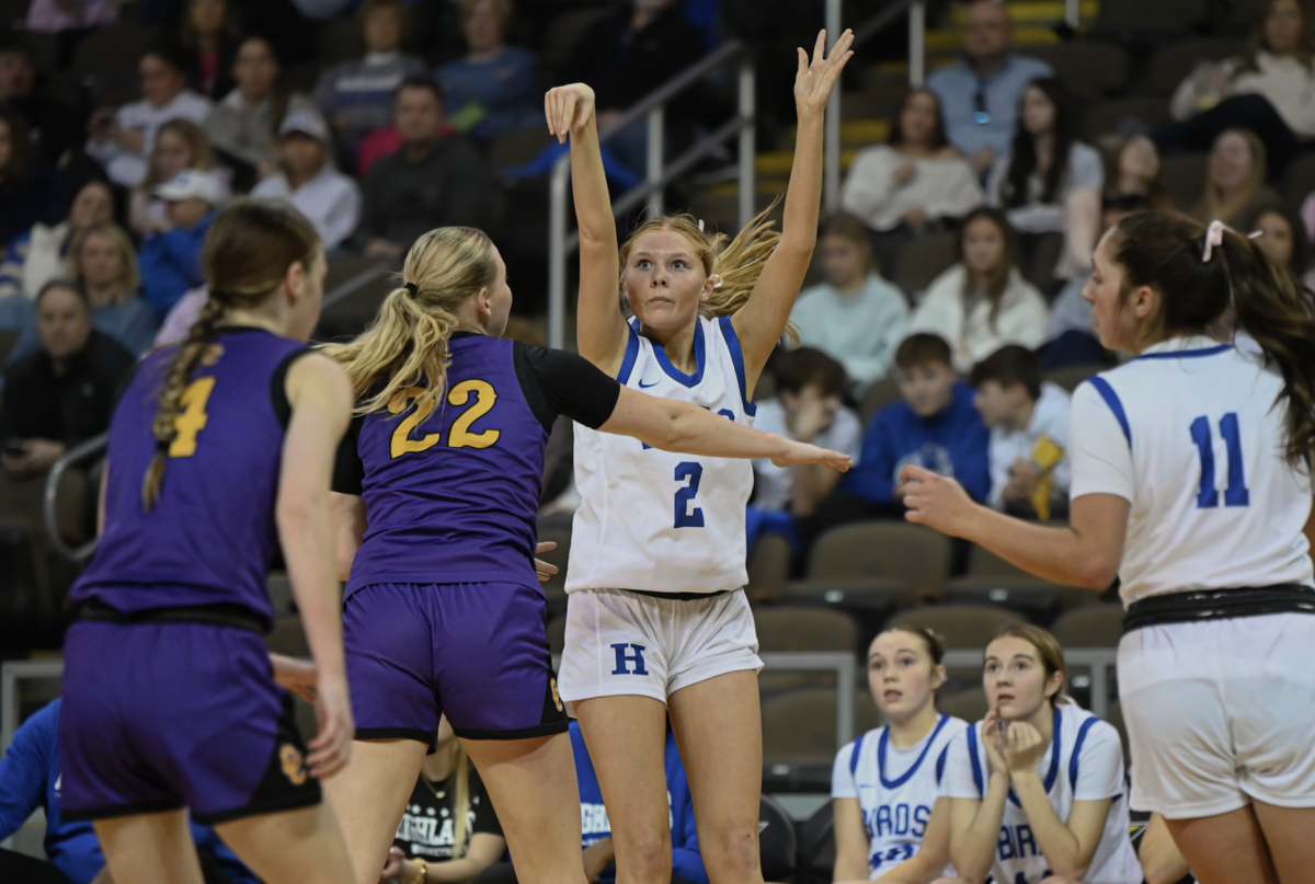 Kaylee Mills (12) shoots a three. “This was an amazing experience and a one of a kind opportunity,” Mills said.
