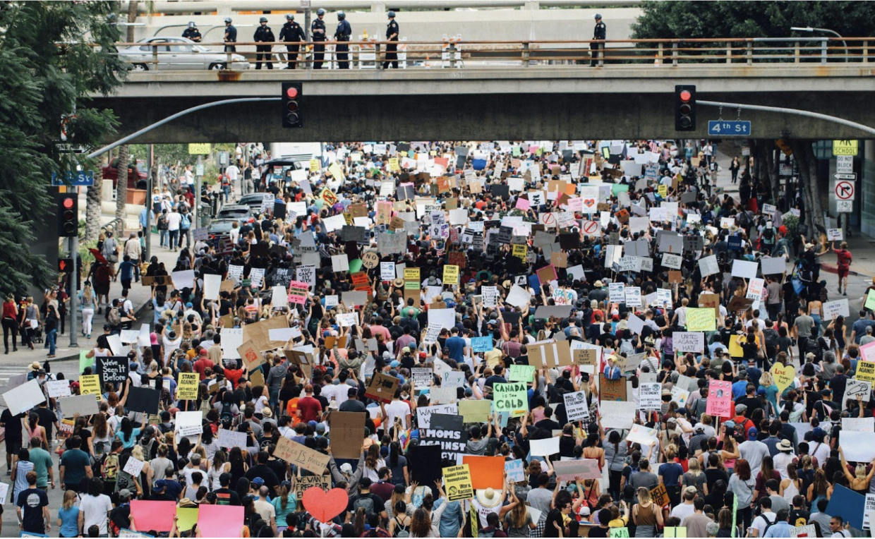 The community gets together to protest against ICE (Courtesy of Alex Radelich, via Unsplash).