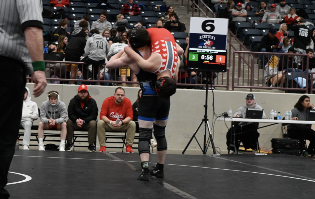 Ryan Nickelman (11) picks his opponent up from the ground