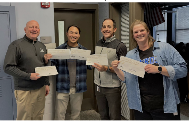 Kevin Listerman, Shih Wen, Matthew Ewald, and Claire LaNicca hold up their certificates. 
