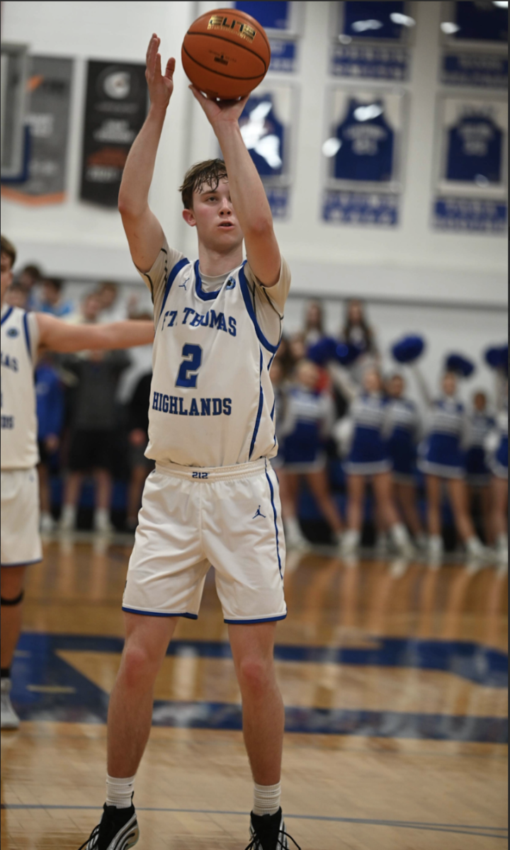 Nathan Rickard (12) shoots a free throw.