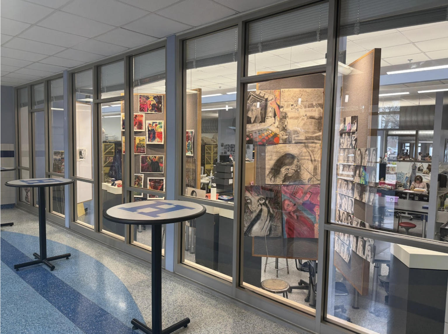 Student art is displayed in the windows for students to enjoy as they walk by.
