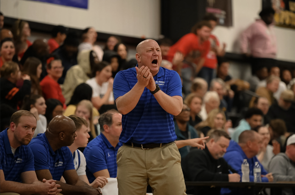 Coach Kevin Listerman shouts toward the court.