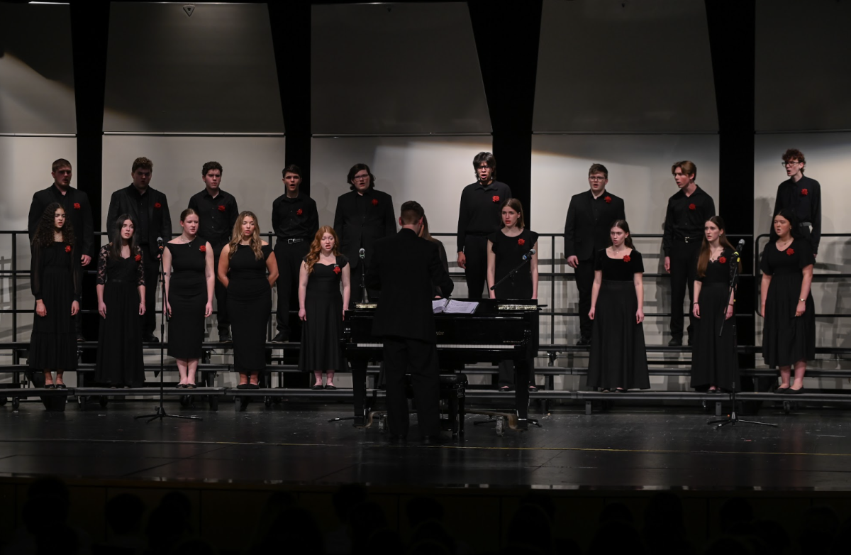 Chamber choir takes the stage. 