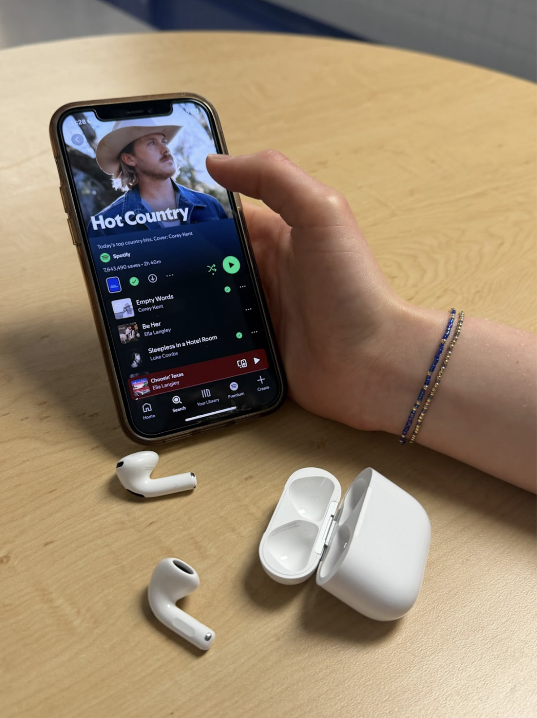Students listen to new country music releases via Spotify.