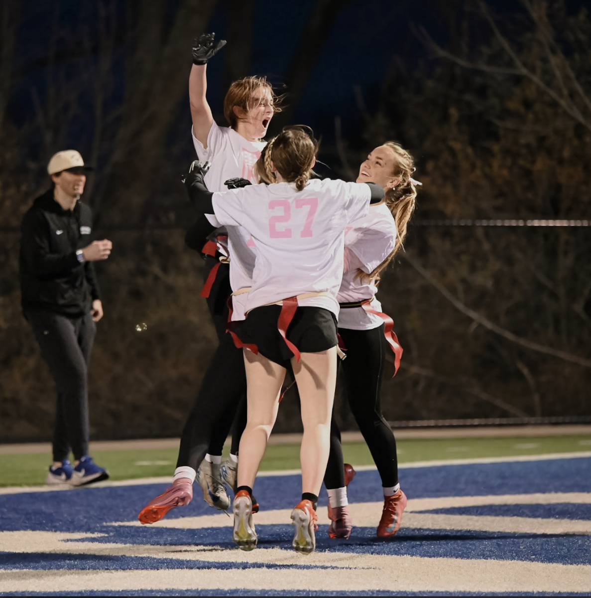 Madison Lickert (11), Avery Schweitzer (11), Lorelai Manning (11), and Gabby Simon (11) celebrate together.
