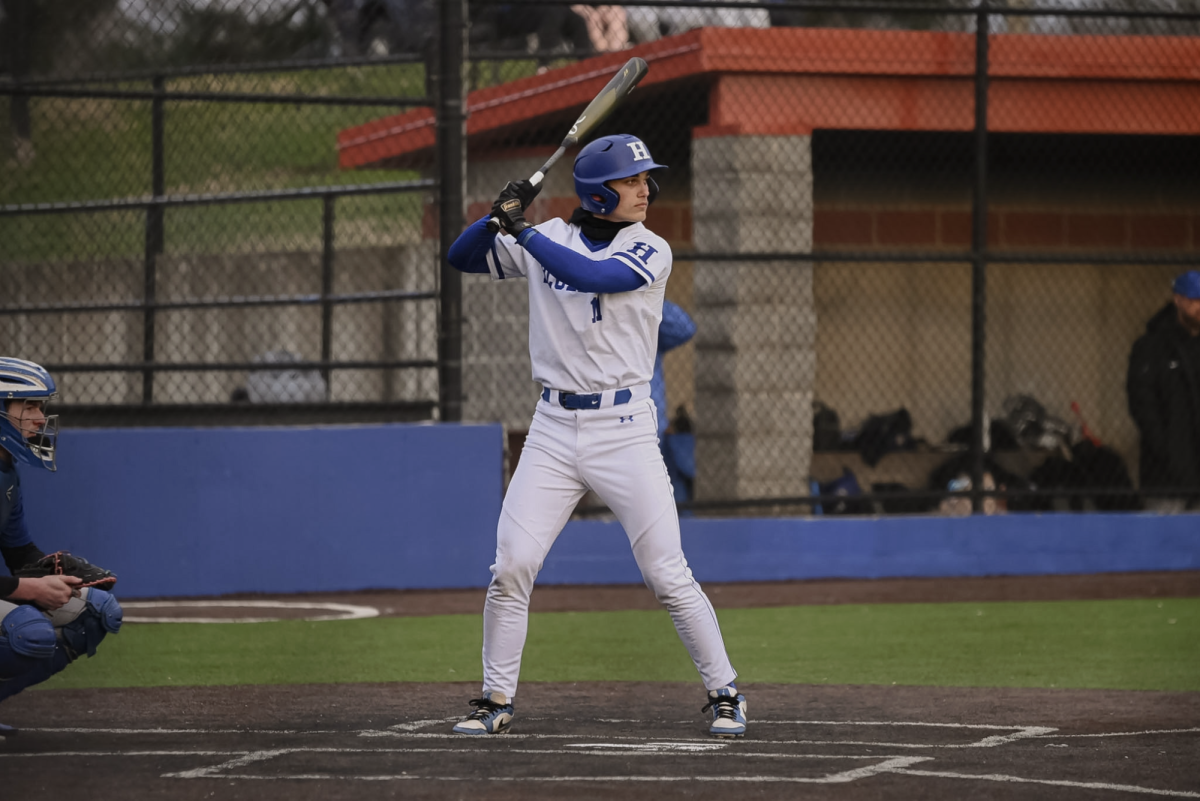 Brooks Hendrix (12) gets ready to hit the ball. "As a team, we came out with good energy and stayed focused, which really set the tone early," Hendrix (12) said.