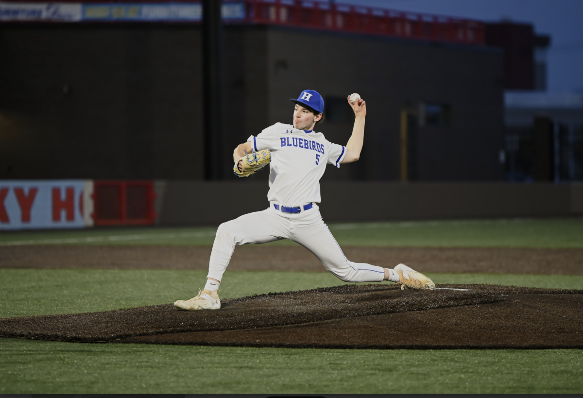 Ronan Thaler (11) throws a pitch.