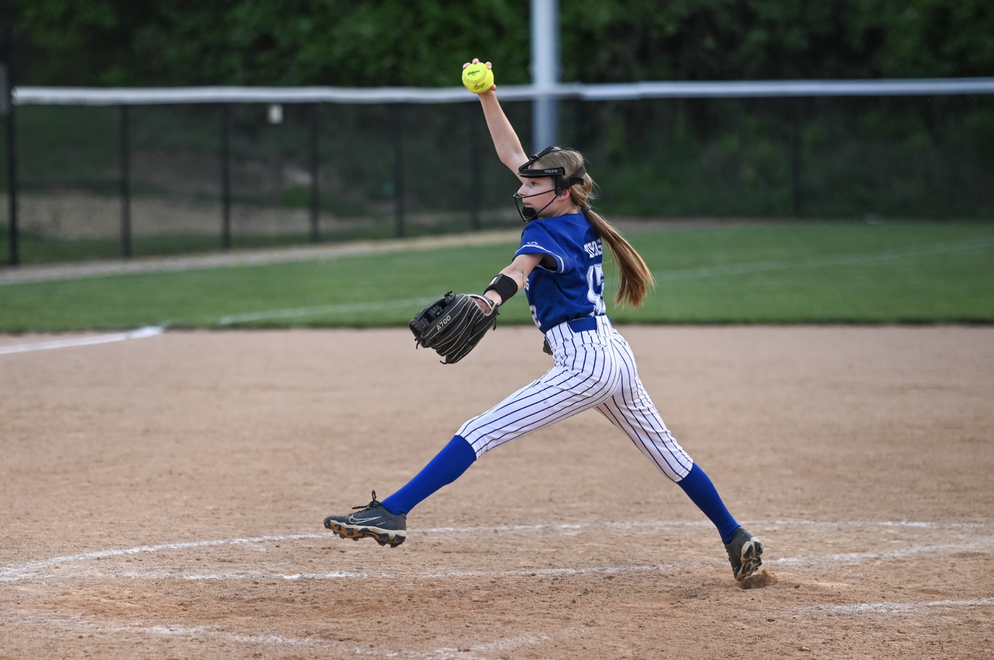 Emily Class (7) pitches the ball.