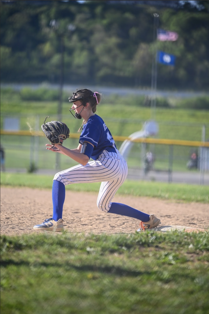 Katherine Heilman (10) catches the ball at first base to get an out.