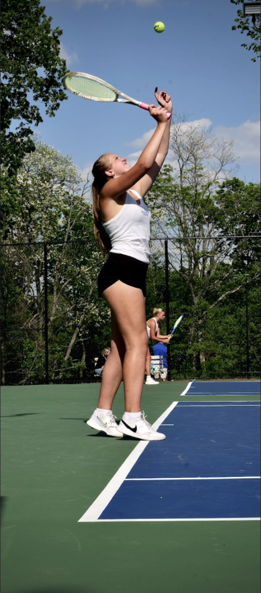 Elena Shadwell (10) prepares to serve.