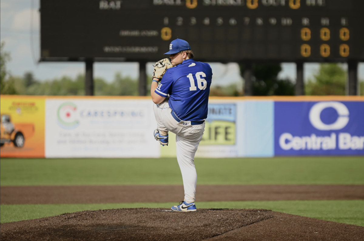 Noah Lahner (12) goes to pitch the ball.