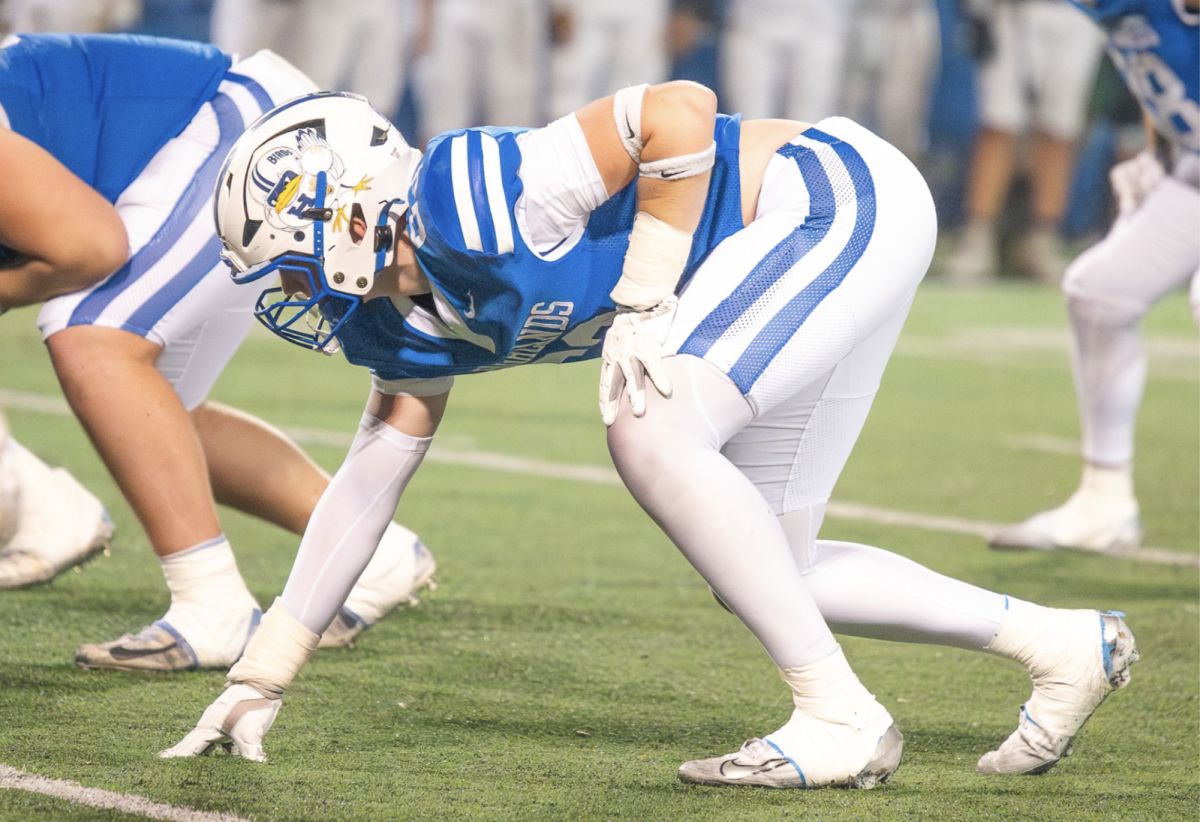 Cooper Benke (11) lines up on defense.