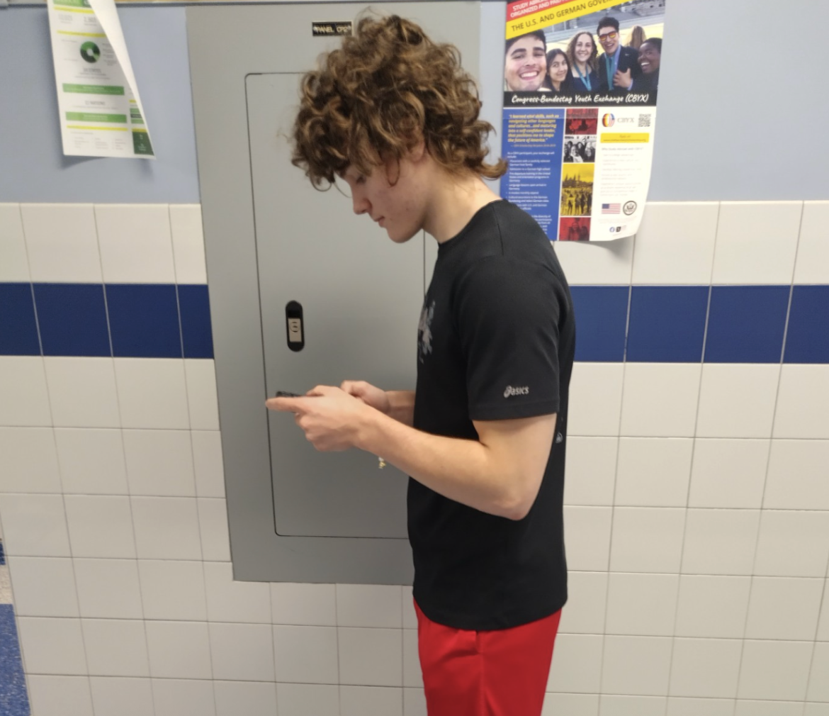 Student Hayden Morgan (12) on the phone.