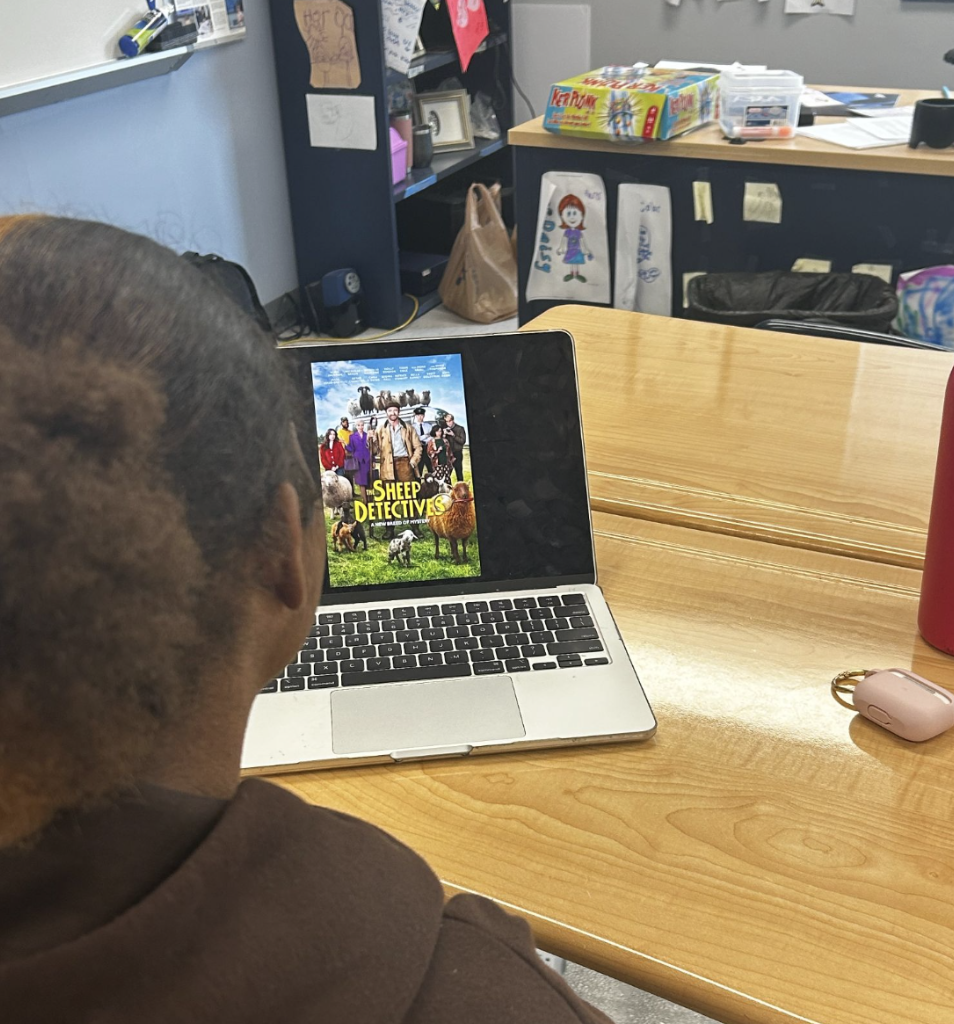 Lauren Comer (9) prepares to watch the sheep detectives on her macbook. 
